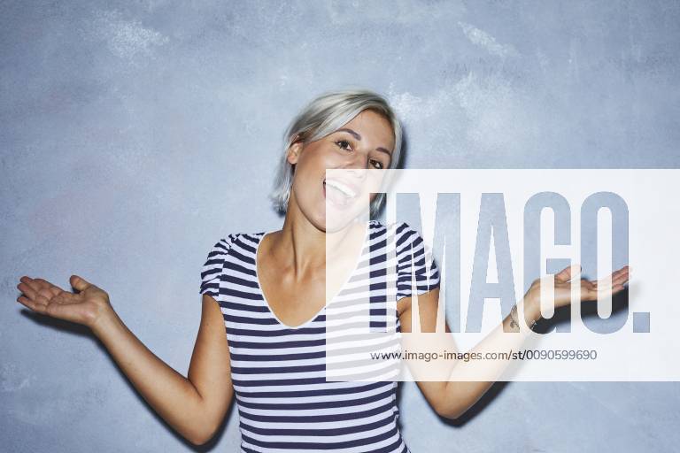 Cheaky young woman making funny faces model released Symbolfoto PNEF01137