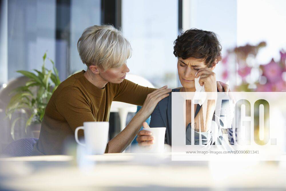 Woman consoling crying friend model released Symbolfoto property released RBF06964