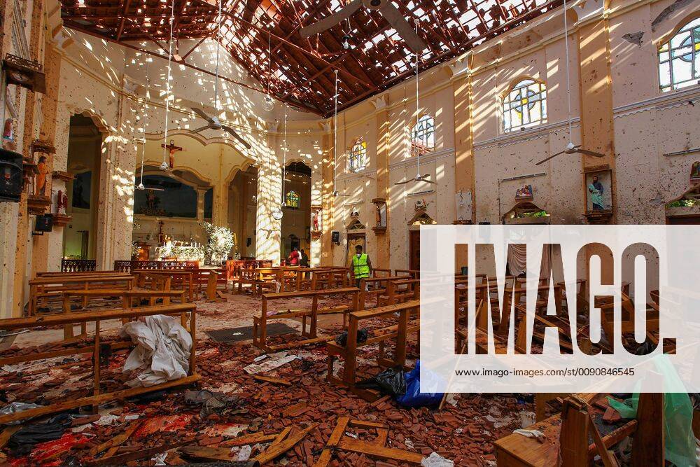 Sri Lankan soldiers look on inside the St Sebastian s Church at Negombo on April 21, 2019, following a bomb blast during the Easter service that killed worshippers. A series of eight devastating bomb blasts ripped through high-end hotels and churches holding Easter services in Sri Lanka on April 21, killing nearly 200 people, including dozens of foreigners. SRI2019042101 PERERAxSAMEER