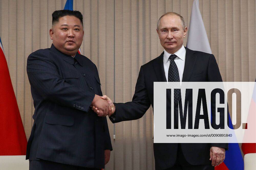 North Korean Leader Kim Jong Un (L) and Russia s President Vladimir Putin shake hands during a meeting at the Far Eastern Federal University (FEFU) on Russky Island. Valery Sharifulin TASS TS0A96E7