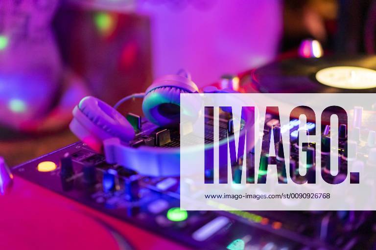 Headphones on illuminated mixing board AFVF02349
