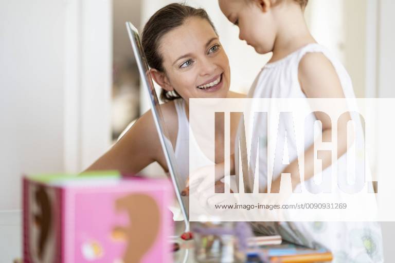 Portrait of smiling mother painting with her little daughter model released Symbolfoto property released DIGF05845