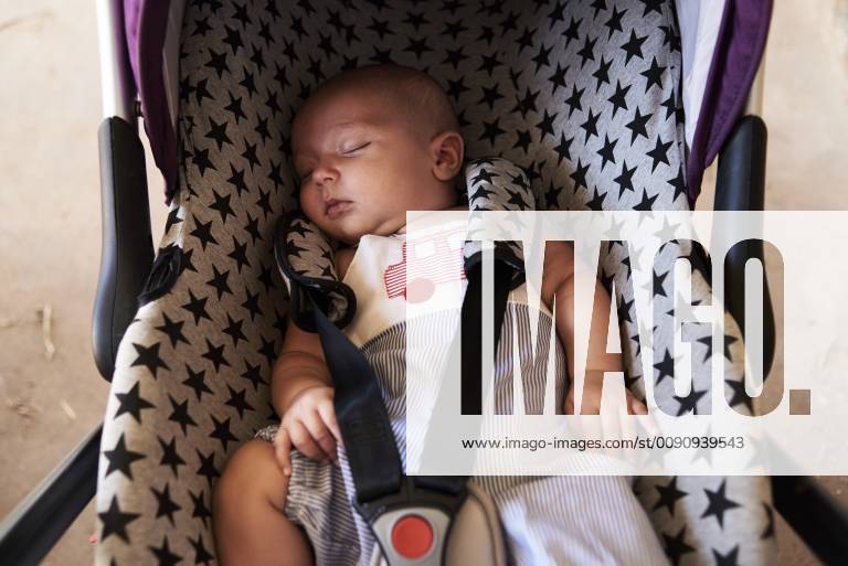 Portrait of little boy sleeping in child safety seat model released Symbolfoto property released IGGF00864
