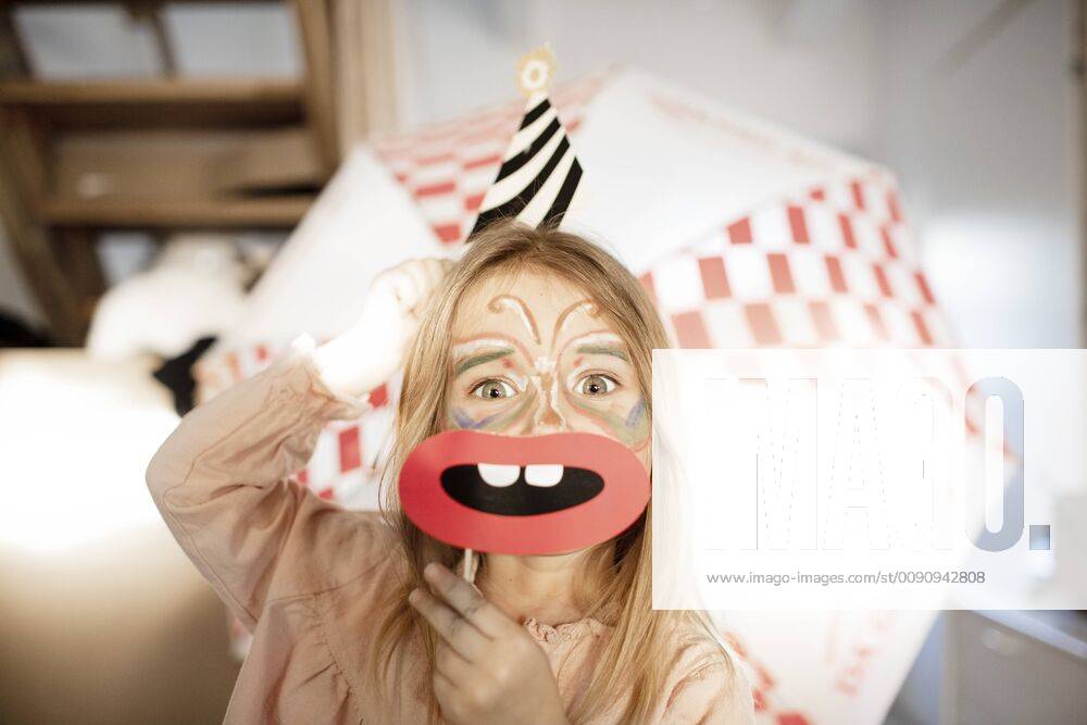Portrait of smiling little girl made up as butterfly model released Symbolfoto property released KMKF00796