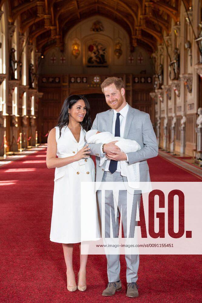 (190508) -- WINDSOR, May 8, 2019 (Xinhua) -- Britain s Prince Harry, Duke of Sussex (R), and his wife Meghan Markle, Duchess of Sussex, pose for a photo with their son in St George s Hall at Windsor Castle in Windsor, Britain, on May 8, 2019. The baby boy, who is Queen Elizabeth s eighth great-grandchild, is seventh in line to the throne, behind the Prince of Wales, the Duke of Cambridge and his children - Prince George, Princess Charlotte and Prince Louis - and Prince Harry. (Xinhua Dominic Lipinski PA Wire) BRITAIN-WINDSOR-ROYALS-BABY