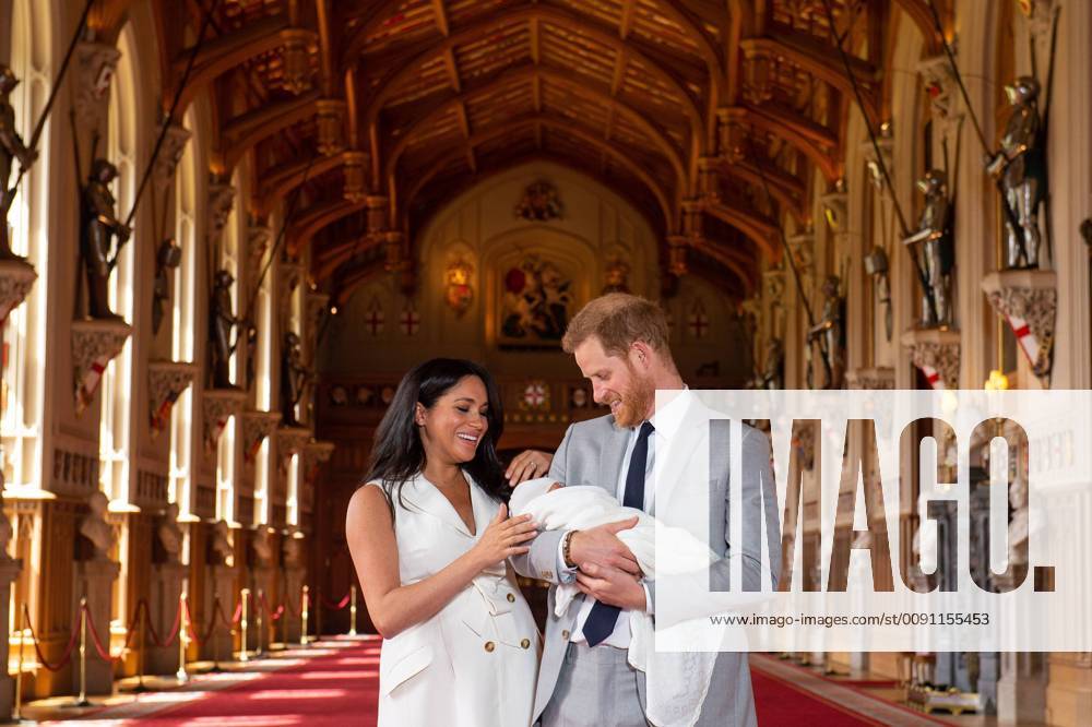 (190508) -- WINDSOR, May 8, 2019 (Xinhua) -- Britain s Prince Harry, Duke of Sussex (R), and his wife Meghan Markle, Duchess of Sussex, pose for a photo with their son in St George s Hall at Windsor Castle in Windsor, Britain, on May 8, 2019. The baby boy, who is Queen Elizabeth s eighth great-grandchild, is seventh in line to the throne, behind the Prince of Wales, the Duke of Cambridge and his children - Prince George, Princess Charlotte and Prince Louis - and Prince Harry. (Xinhua Dominic Lipinski PA Wire) BRITAIN-WINDSOR-ROYALS-BABY