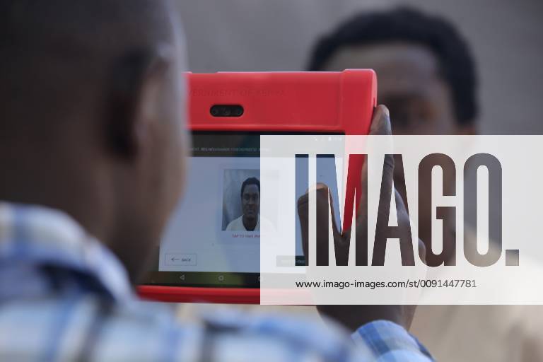 Kipcherere, Bariongo, Kenya - An officer from the National Integrated Identity Management system (NIIMS) seen taking a photo of Mr. Charles Chepkwony to process his biometric data during Kenyas nationwide campaign seeking to Marge personal information into single electronic document called ˜Huduma Namba..The 45-day registration started on April and ended on 18 May 2019, but countrys President Uhuru Kenyatta extended the exercise to 25 May 2019. Kipcherere Kenya - ZUMAs197 20190520_zaa_s197_263