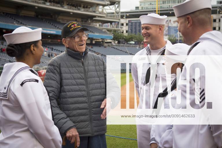 Washington, District of Columbia, U.S. - The Navy Sailors of the Year speak to World War II veteran Walter Green at Nationals Park in Washington, D.C. The Washington Nationals honored the Navy Sailors of the Year (SOY) during a pre-game ceremony. The program was established in 1972 by Chief of Naval Operations Adm. Elmo Zumwalt and Master Chief Petty Officer of the Navy John Whittet to recognize an individual Sailor who best represented the ever-growing group of dedicated professional Sailors at each command and ultimately the Navy. SOY finalists participated in a variety of leadership, naval heritage and team-building events throughout the week around Washington D.C. Washington U.S. - ZUMAz03_ 20190515_sha_z03_861