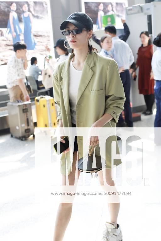 Chinese actress Zhong Chuxi arrives at the Shanghai Hongqiao International Airport before departure in Shanghai, China, 23 May 2019. Handbag: Louis Vuitton Zhong Chuxi arrives at Shanghai airport before departure bjl9767093