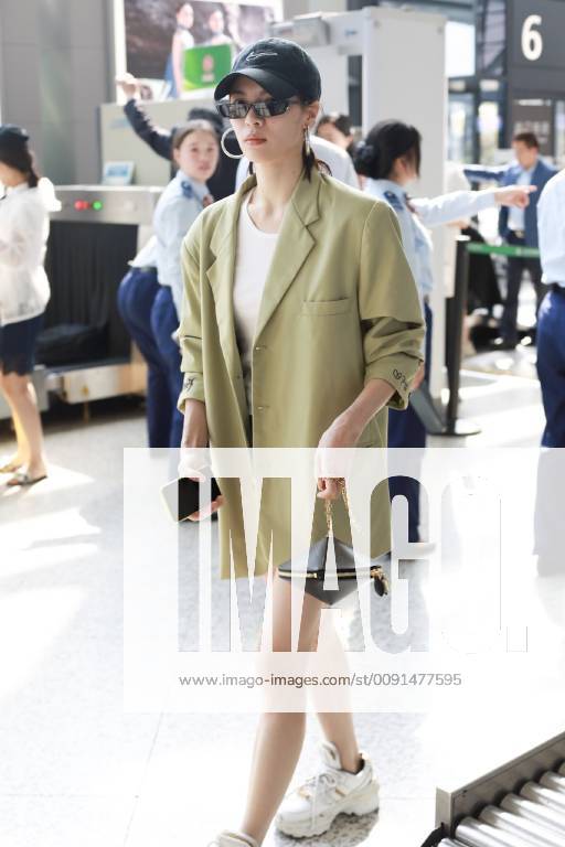 Chinese actress Zhong Chuxi arrives at the Shanghai Hongqiao International Airport before departure in Shanghai, China, 23 May 2019. Handbag: Louis Vuitton Zhong Chuxi arrives at Shanghai airport before departure bjl9767094