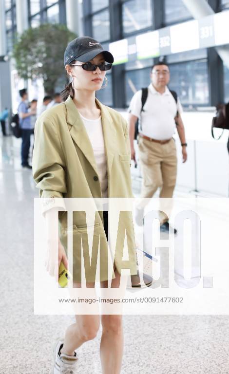 Chinese actress Zhong Chuxi arrives at the Shanghai Hongqiao International Airport before departure in Shanghai, China, 23 May 2019. Handbag: Louis Vuitton Zhong Chuxi arrives at Shanghai airport before departure bjl9767072
