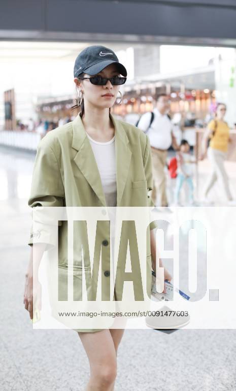 Chinese actress Zhong Chuxi arrives at the Shanghai Hongqiao International Airport before departure in Shanghai, China, 23 May 2019. Handbag: Louis Vuitton Zhong Chuxi arrives at Shanghai airport before departure bjl9767073