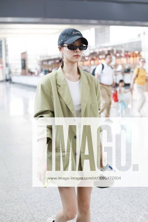Chinese actress Zhong Chuxi arrives at the Shanghai Hongqiao International Airport before departure in Shanghai, China, 23 May 2019. Handbag: Louis Vuitton Zhong Chuxi arrives at Shanghai airport before departure bjl9767074