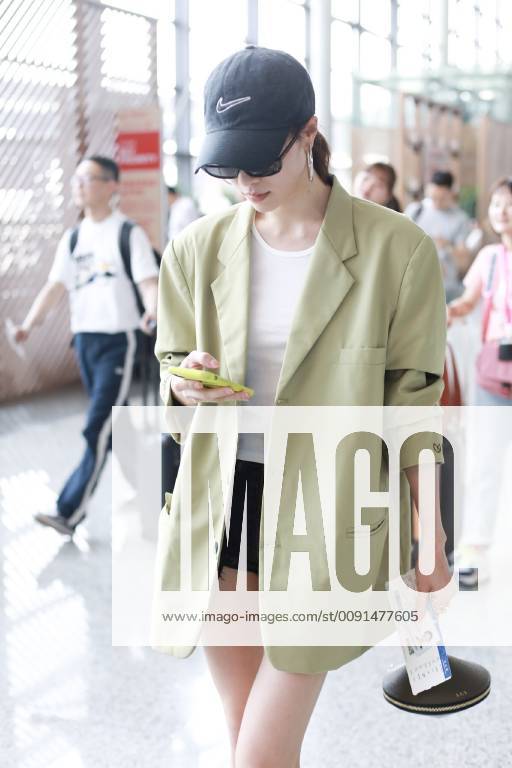 Chinese actress Zhong Chuxi arrives at the Shanghai Hongqiao International Airport before departure in Shanghai, China, 23 May 2019. Handbag: Louis Vuitton Zhong Chuxi arrives at Shanghai airport before departure bjl9767077