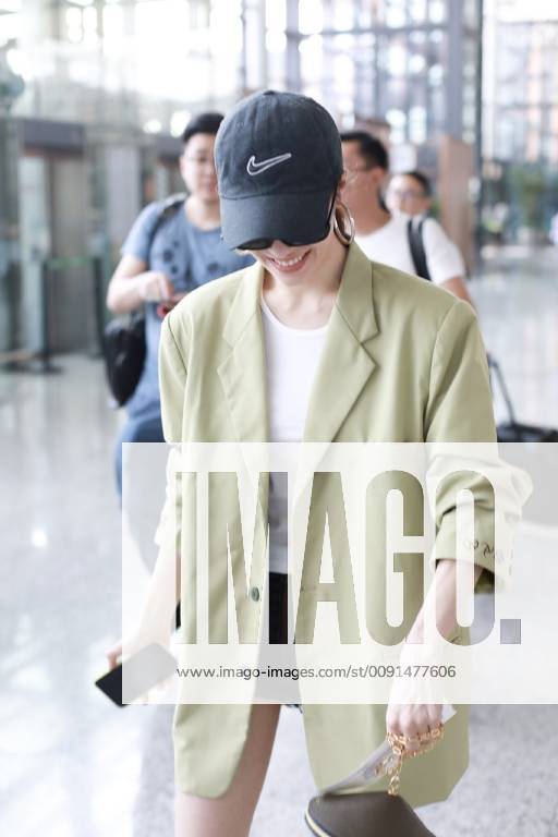 Chinese actress Zhong Chuxi arrives at the Shanghai Hongqiao International Airport before departure in Shanghai, China, 23 May 2019. Handbag: Louis Vuitton Zhong Chuxi arrives at Shanghai airport before departure bjl9767078