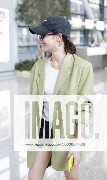Chinese actress Zhong Chuxi arrives at the Shanghai Hongqiao International Airport before departure in Shanghai, China, 23 May 2019. Handbag: Louis Vuitton Zhong Chuxi arrives at Shanghai airport before departure bjl9767081