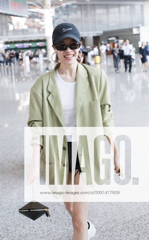Chinese actress Zhong Chuxi arrives at the Shanghai Hongqiao International Airport before departure in Shanghai, China, 23 May 2019. Handbag: Louis Vuitton Zhong Chuxi arrives at Shanghai airport before departure bjl9767082