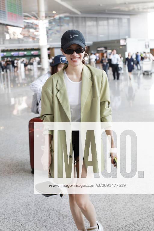 Chinese actress Zhong Chuxi arrives at the Shanghai Hongqiao International Airport before departure in Shanghai, China, 23 May 2019. Handbag: Louis Vuitton Zhong Chuxi arrives at Shanghai airport before departure bjl9767083