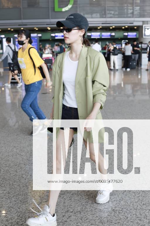 Chinese actress Zhong Chuxi arrives at the Shanghai Hongqiao International Airport before departure in Shanghai, China, 23 May 2019. Handbag: Louis Vuitton Zhong Chuxi arrives at Shanghai airport before departure bjl9767089