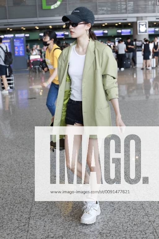 Chinese actress Zhong Chuxi arrives at the Shanghai Hongqiao International Airport before departure in Shanghai, China, 23 May 2019. Handbag: Louis Vuitton Zhong Chuxi arrives at Shanghai airport before departure bjl9767090