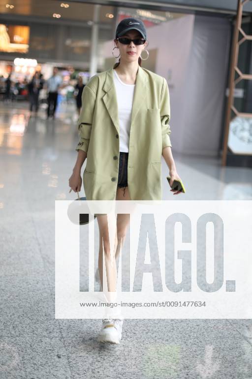 Chinese actress Zhong Chuxi arrives at the Shanghai Hongqiao International Airport before departure in Shanghai, China, 23 May 2019. Handbag: Louis Vuitton Zhong Chuxi arrives at Shanghai airport before departure bjl9766893