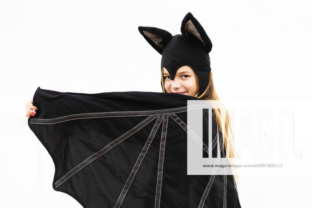 Portrait of girl in bat costume spreading wings model released Symbolfoto property released ERRF00989