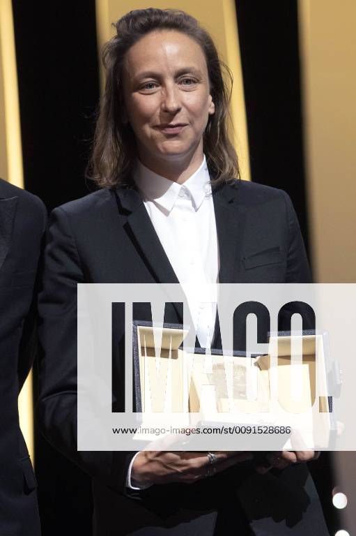 Celine Sciamma accepts the Best Screenplay Award for the movie Portrait Of A Lady On Fire at the award ceremony during the 72nd Cannes Film Festival at the Palais des Festivals on May 25, 2019 in Cannes, France