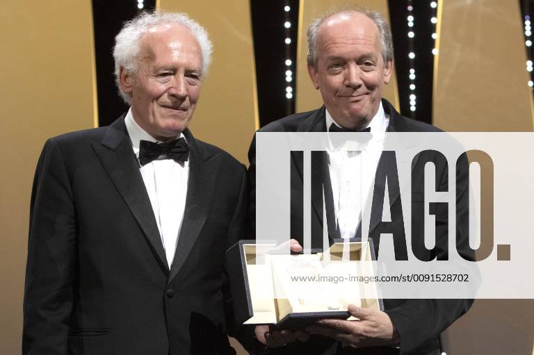 Jean-Pierre Dardenne and Luc Dardenne accept the Best Director Award for their movie Le Jeune Ahmed Young Ahmed at the award ceremony during the 72nd Cannes Film Festival at the Palais des Festivals on May 25, 2019 in Cannes, France