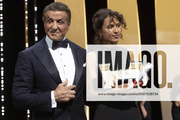 Mati Diop accepts the Grand Prize of the Festival for the movie Atlantique Atlantics) from US actor Sylvester Stallone at the award ceremony during the 72nd Cannes Film Festival at the Palais des Festivals on May 25, 2019 in Cannes, France