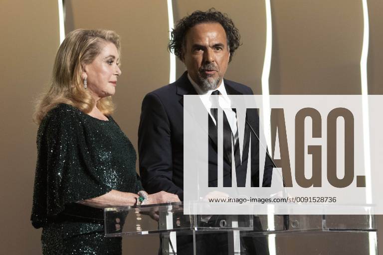 Catherine Deneuve and Alejandro Gonzalez Inarritu at the award ceremony during the 72nd Cannes Film Festival at the Palais des Festivals on May 25, 2019 in Cannes, France