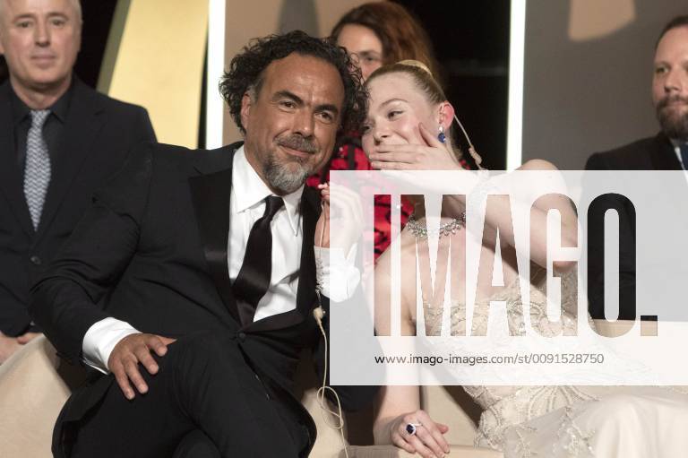 Alejandro Gonzalez Inarritu and Elle Fanning at the award ceremony during the 72nd Cannes Film Festival at the Palais des Festivals on May 25, 2019 in Cannes, France