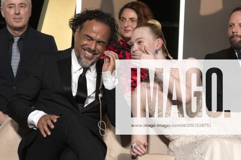 Alejandro Gonzalez Inarritu and Elle Fanning at the award ceremony during the 72nd Cannes Film Festival at the Palais des Festivals on May 25, 2019 in Cannes, France
