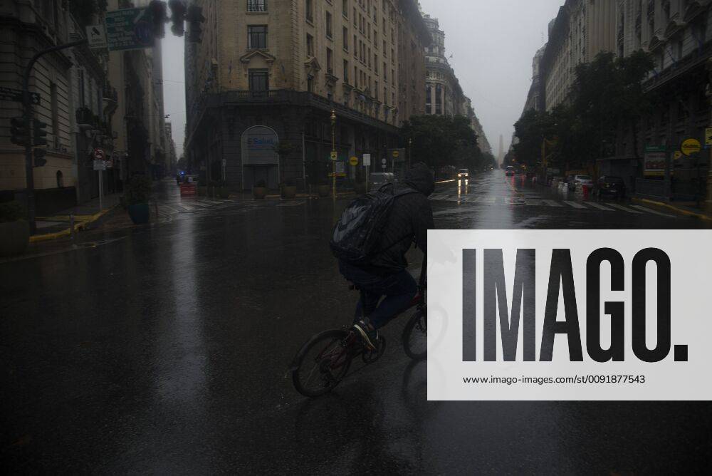 A man rides a bike in front the Obelisk, during the black out and under a heavy rain. The biggest blackout in the Argentina s history took place this Sunday, leaving the entire country without electric power and also affected some sectors of Uruguay. Buenos Aires Argentina - ZUMAn230 20190616_zaa_n230_169