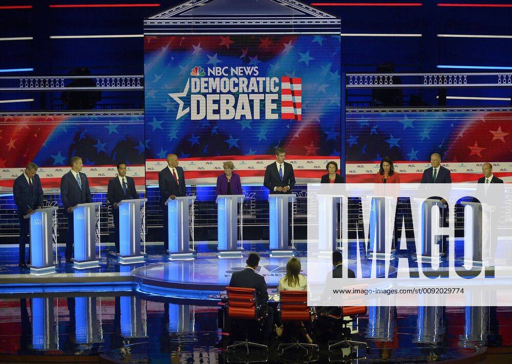 Democratic presidential primary candidates stand before moderators at the NBC, MSNBC, Telemundo Democratic Debate at the Knight Concert Hall in Miami, Florida on Wednesday, June 26, 2019. Appearing on stage are Sen. Cory Booker, Sec. Julian Castro, Mayor Bill De Blasio, Rep. Tulsi Gabbard, Rep. John Delaney, Gov. Jay Inslee, Sen. Amy Klobuchar, Rep. Beto O Rourke, Rep. Tim Ryan and Sen. Elizabeth Warren. The debate was moderated by Lester Holt, Savannah Guthrie, Chuck Todd, Rachel Maddow and Jose D?az-Balart. WAX20190626251 GUSTAVOxCABELLERO