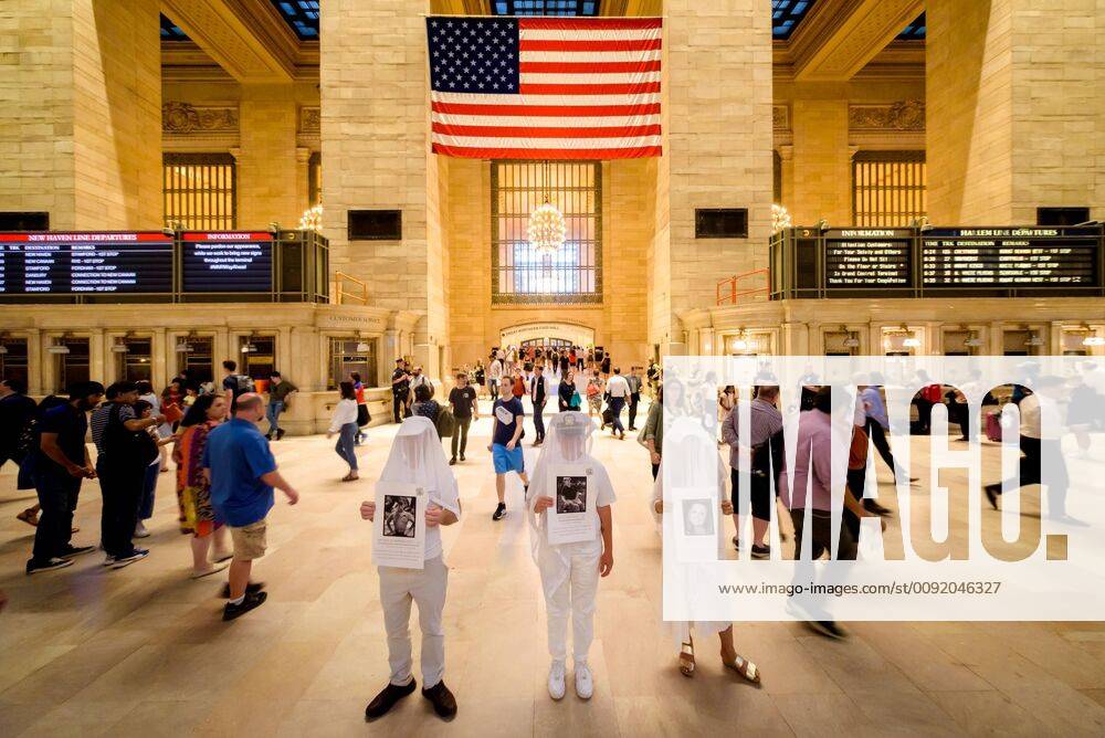 NYC: Silent vigil on PTSD awareness day Activist group Gays Against Guns held a silent vigil in Grand Central Station on June 27, 2019 to help raise awareness about PTSD bringing their iconic ‘Human Beings’ - silent figures veiled and dressed in white who honor gun violence victims, holding placards to highlight the forgotten victims of PTSD who take their own lives. New York New York United States Grand Central Station ErikxMcGregor