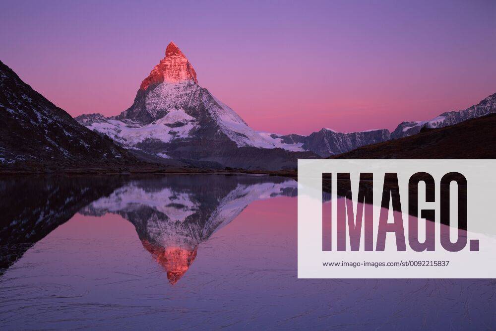 Matterhorn (4,478m) with reflection in Lake Riffel at sunrise, Switzerland, September 2008. WWE BOOK. WWE OUTDOOR EXHIBITION. NOT TO BE USED FOR GREETING CARDS OR CALENDARS *PRESS IMAGE 1281379 WildxWondersxofxEuropexPopp-Hackner