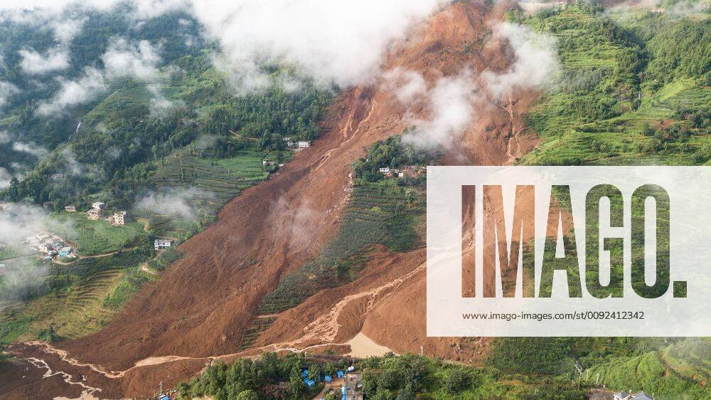 (190724) -- SHUICHENG, July 24, 2019 -- Aerial photo taken on July 24, 2019 shows a landslide site in Pingdi Village in Shuicheng County of Liupanshui City, southwest China s Guizhou Province. Eleven people are dead after a landslide hit Pingdi Village late Tuesday, local authorities said Wednesday. At about 9:20 p.m. (1320 GMT) Tuesday, a landslide lashed the village, burying 21 houses. More than 50 people were living in the affected area when the landslide struck, according to rescuers. As of about 11 a.m. (0300 GMT) Wednesday, 11 people were found dead, 11 others were rescued, and 34 remained missing. ) CHINA-GUIZHOU-LIUPANSHUI-LANDSLIDE (CN) TaoxLiang