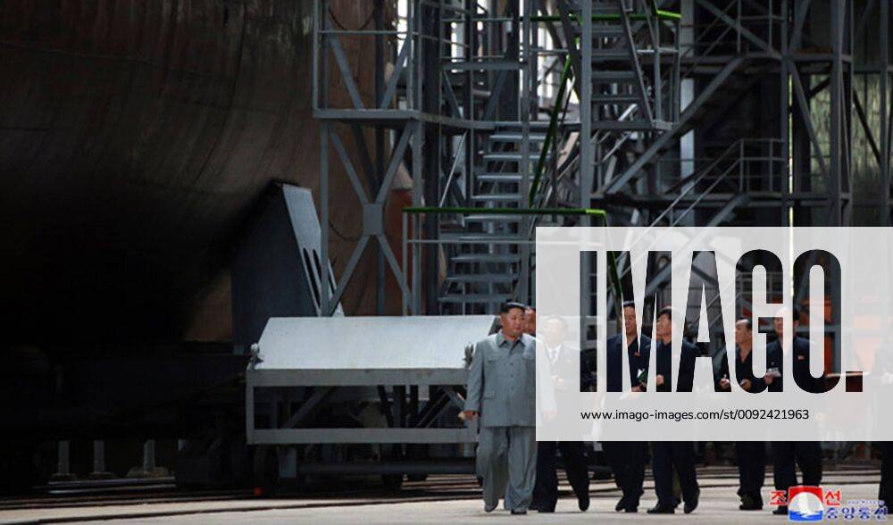 KW30 This image, released on July 23, 2019, by the North Korean Official News Service (KCNA), shows North Korean leader Kim Jong Un inspecting a newly built submarine. Kim, who expressed great satisfaction over the fact that the submarine was designed and built to be capable of fully implementing the military-strategic intention, learned in detail about its operational and tactical data and combat weapon systems. WAX2019072403 KCNA