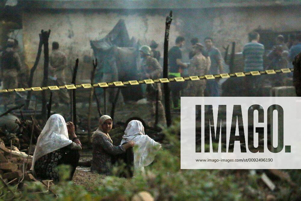 KW31 (190730) -- RAWALPINDI, July 30, 2019 -- Security officials examine the plane crash site on the outskirts of Rawalpindi, Pakistan, on July 30, 2019. A trainer plane of Pakistani army crashed at a residential area on early Tuesday morning in Pakistan s eastern district of Rawalpindi, killing at least 12 persons and leaving 10 others injured, local media and military said. ) PAKISTAN-RAWALPINDI-PLANE-CRASH AhmadxKamal