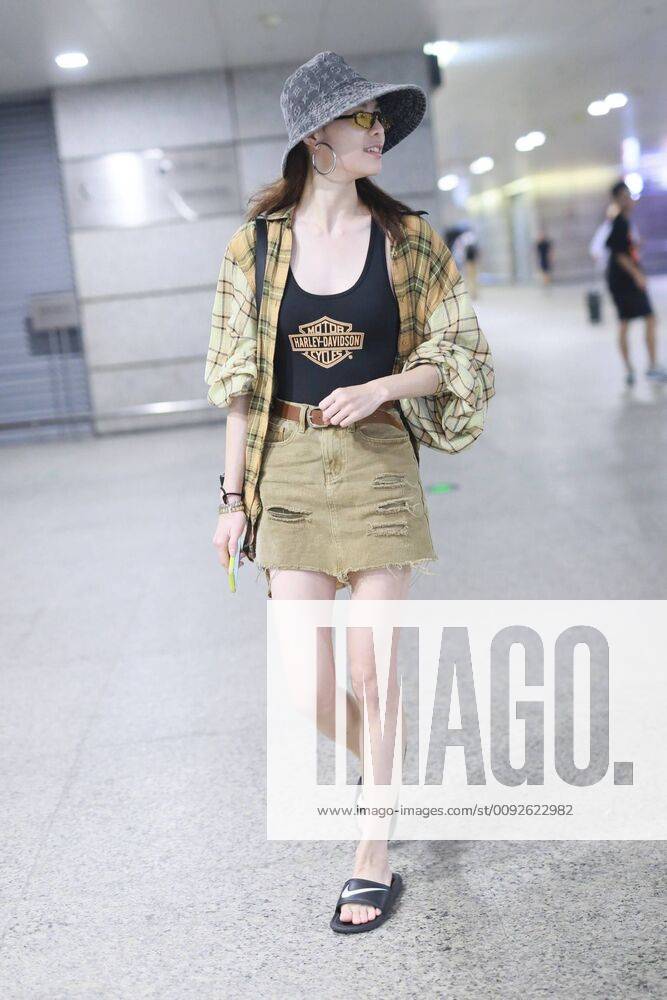Chinese actress Zhong Chuxi arrives at the Shanghai Hongqiao International Airport after landing in Shanghai, China, 7 August 2019. Handbag & Hat & Baggage: Louis Vuitton Shoes: Nike Zhong Chuxi shows up at Shanghai airport after landing bjl13690751