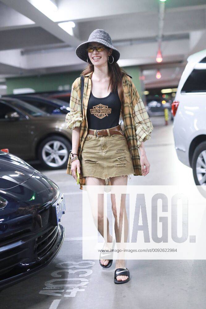 Chinese actress Zhong Chuxi arrives at the Shanghai Hongqiao International Airport after landing in Shanghai, China, 7 August 2019. Handbag & Hat & Baggage: Louis Vuitton Shoes: Nike Zhong Chuxi shows up at Shanghai airport after landing bjl13690750