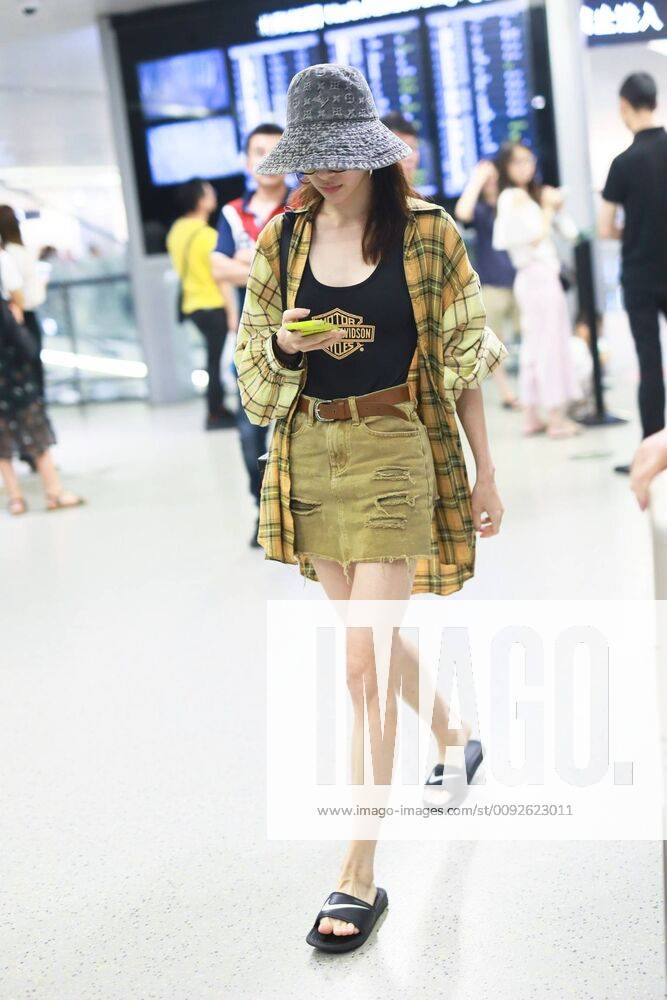 Chinese actress Zhong Chuxi arrives at the Shanghai Hongqiao International Airport after landing in Shanghai, China, 7 August 2019. Handbag & Hat & Baggage: Louis Vuitton Shoes: Nike Zhong Chuxi shows up at Shanghai airport after landing bjl13690739