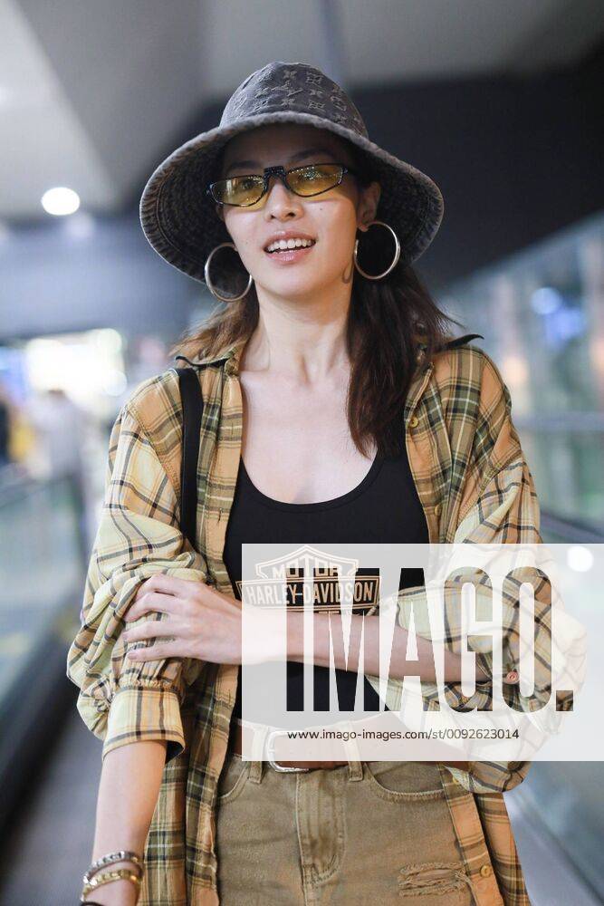Chinese actress Zhong Chuxi arrives at the Shanghai Hongqiao International Airport after landing in Shanghai, China, 7 August 2019. Handbag & Hat & Baggage: Louis Vuitton Shoes: Nike Zhong Chuxi shows up at Shanghai airport after landing bjl13690742
