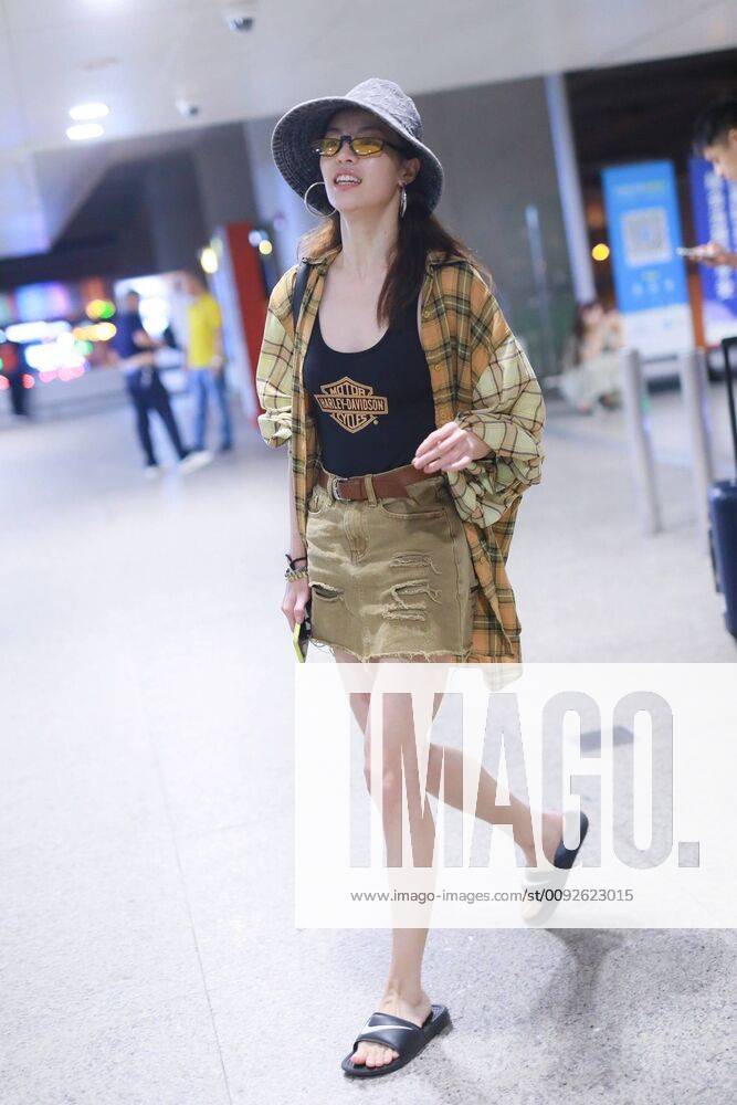 Chinese actress Zhong Chuxi arrives at the Shanghai Hongqiao International Airport after landing in Shanghai, China, 7 August 2019. Handbag & Hat & Baggage: Louis Vuitton Shoes: Nike Zhong Chuxi shows up at Shanghai airport after landing bjl13690743