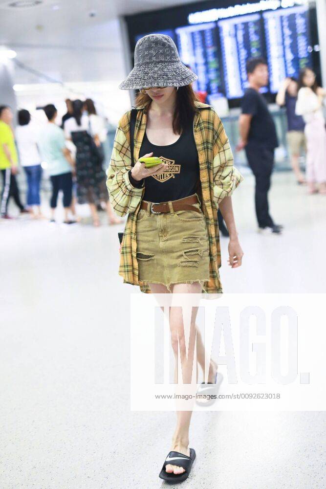 Chinese actress Zhong Chuxi arrives at the Shanghai Hongqiao International Airport after landing in Shanghai, China, 7 August 2019. Handbag & Hat & Baggage: Louis Vuitton Shoes: Nike Zhong Chuxi shows up at Shanghai airport after landing bjl13690748