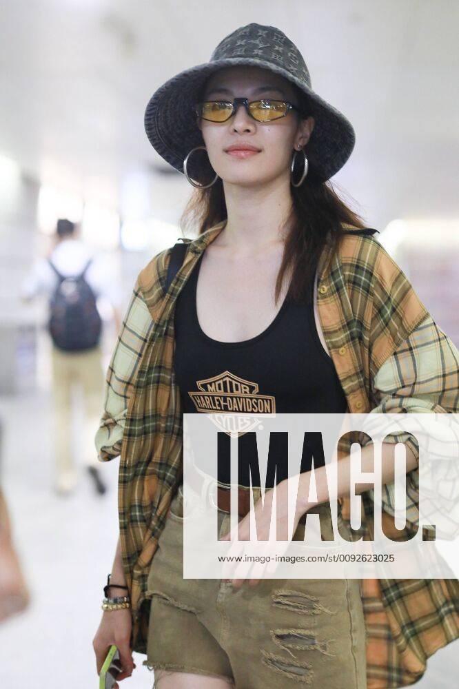 Chinese actress Zhong Chuxi arrives at the Shanghai Hongqiao International Airport after landing in Shanghai, China, 7 August 2019. Handbag & Hat & Baggage: Louis Vuitton Shoes: Nike Zhong Chuxi shows up at Shanghai airport after landing bjl13690746