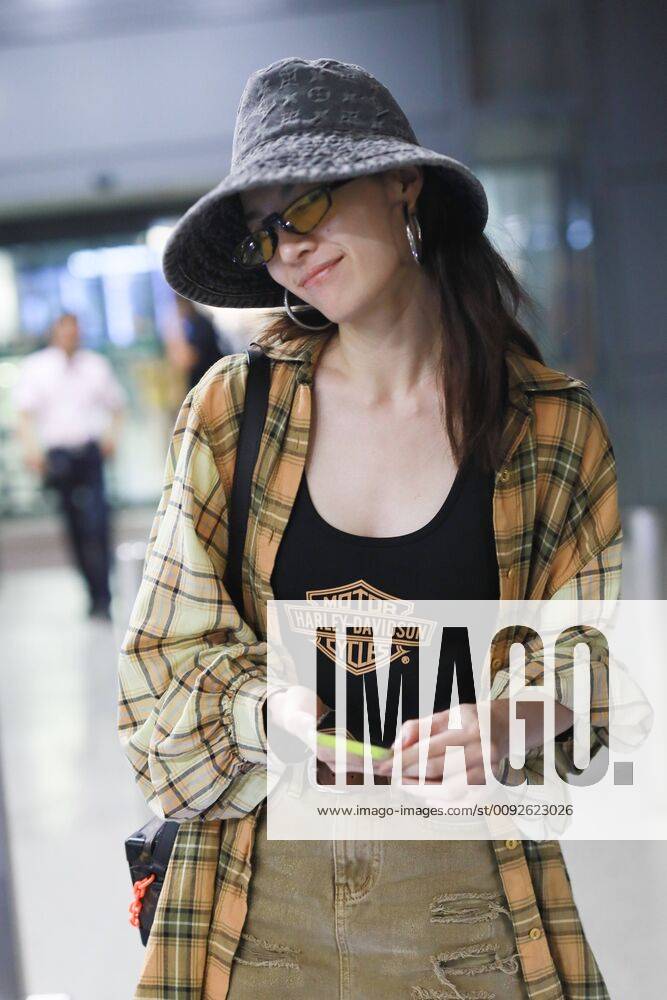 Chinese actress Zhong Chuxi arrives at the Shanghai Hongqiao International Airport after landing in Shanghai, China, 7 August 2019. Handbag & Hat & Baggage: Louis Vuitton Shoes: Nike Zhong Chuxi shows up at Shanghai airport after landing bjl13690749