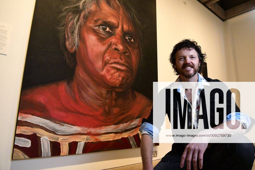 ARCHIBALD PEOPLE?S CHOICE AWARD, Artist David Darcy poses for a photograph in front of his portrait of Aboriginal Elder Daisy Tjuparntarri Ward at the Art Gallery of NSW in Sydney, Wednesday, August 14, 2019. David Darcy s portrait of Daisy, Tjuparntarri - Women s Business , has won the 2019 Archibald People s Choice award. ( NO ARCHIVING, , NO USE IN BOOKS WITHOUT CONSENT SYDNEY NSW AUSTRALIA