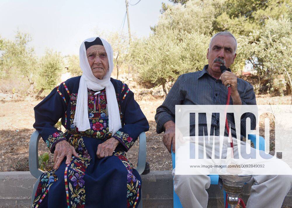 (L-R) MuftiaTlaib, the grandmother of U.S. Congress representative Rashida Tlaib, sits with her son, Issa, outside the family s home in the West Bank village Beit Ur Al-Fauqa, Friday, August 16, 2019. Congress women Rashida Tlaib and Ilhan Omar were banned from entering Israel and the Palestinian territories by the Israeli government after U.S. President Donald Trump tweeted letting them enter would make Israel seem weak. JER20190816010 DEBBIExHILL