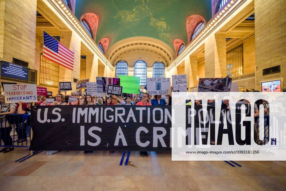 Members of the activist group Resist gathered a silent protest inside the main hall at Grand Central Station holding NO RAIDS CLOSE THE CAMPS ABOLISH ICE banners, photographs of the children who have died in ICE custody, and photographs of the detention camps to object to Border Patrol and ICE treatment of immigrants, refugees, and asylum seekers. USA - ZUMAm432 20190829_znp_m432_016